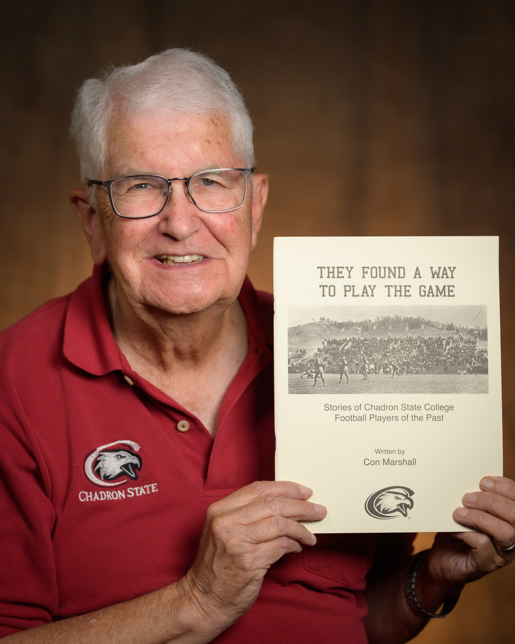 Con Marshall poses with his book 