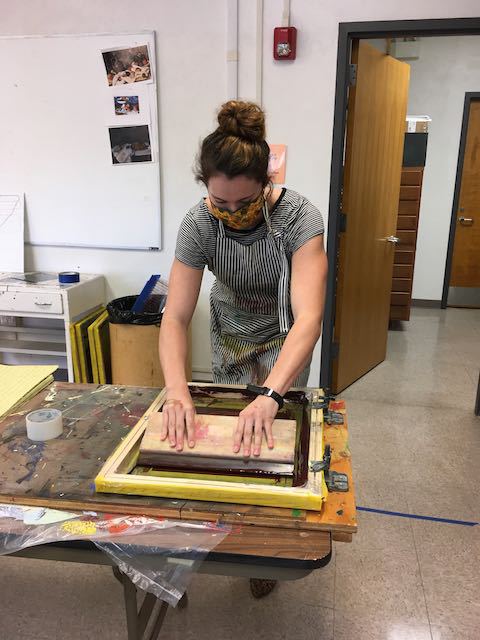 McKensi Webel applies ink to a collaborative print in June.