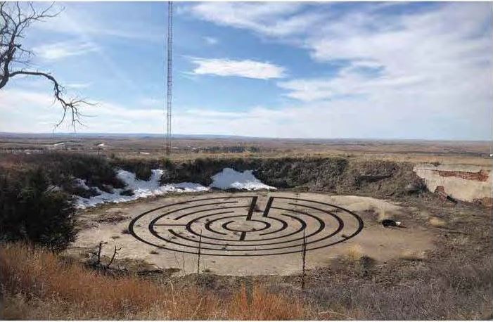 The abandoned water cistern west of C-Hill that once served as Chadron's water storage tank with a drawing of a possible labyrinth design.