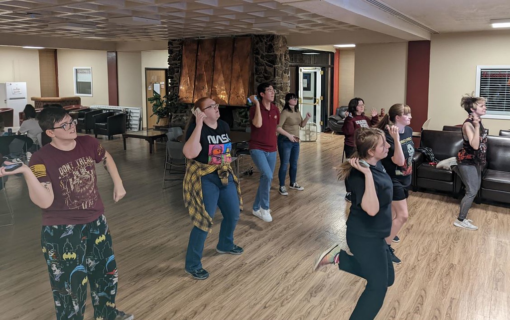 Eight CSC students play Just Dance in The Hub, hosted by the Esports Club.