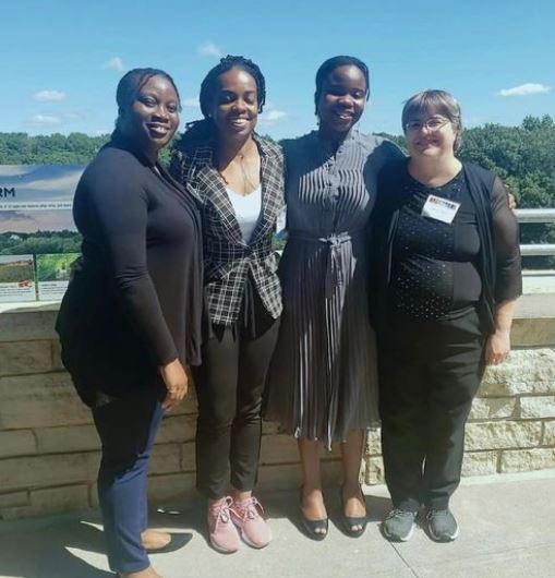 Four women standing