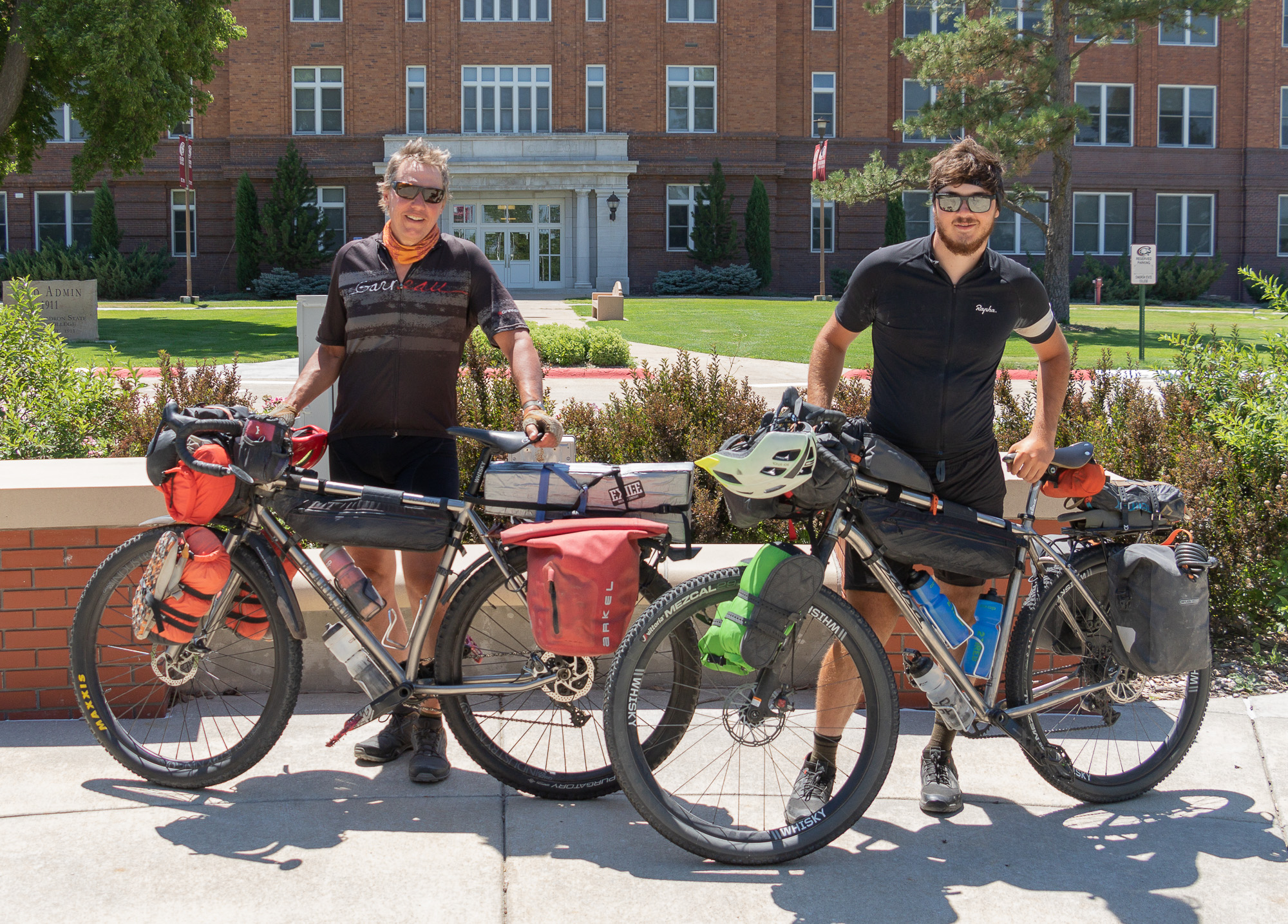 two men with bicycles