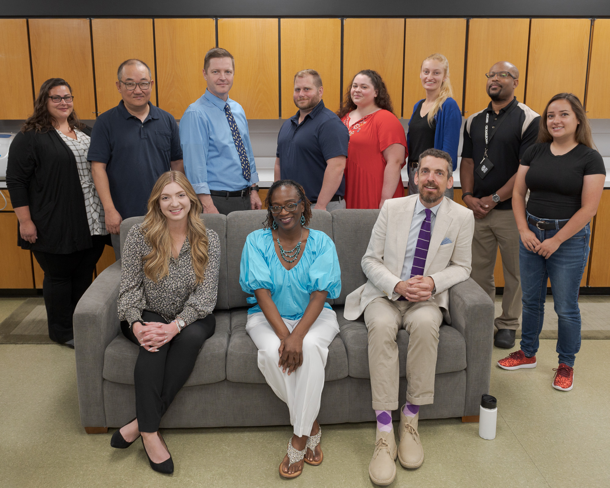 New faculty and staff pose for a group photo Thursday, August 18, 2022 in the King Library. Seated, from left: Katelyn Lambert, Janet Anthony, Jeremy Quick. Standing: Gabriella Pruitt Santos, Haesong Kwon, Matthew Bower, Nathan Favaloro, Danielle Covolo, Katie Hughes, Julian Berrian, Cat Evans.