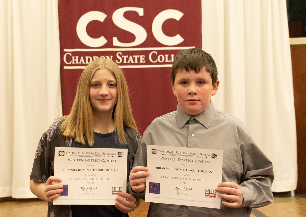 Two high school students pose with their awards as CSC hosts History Day