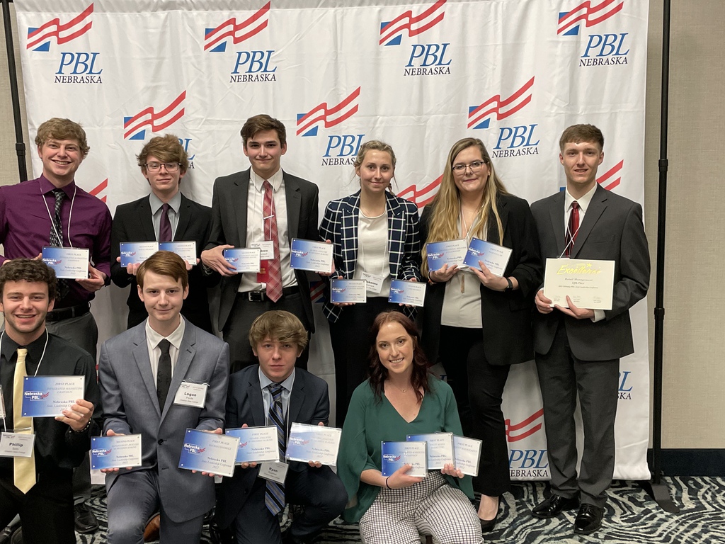 Ten CSC PBL Members stand holding their awards