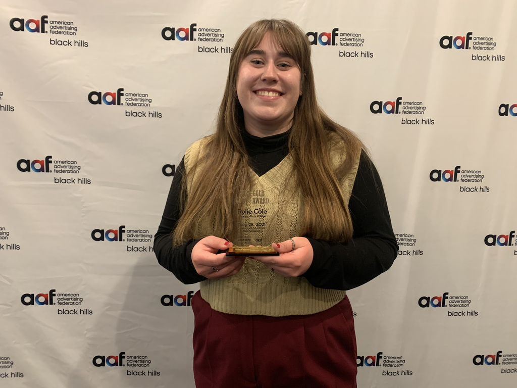 Rylie Cole poses with the award