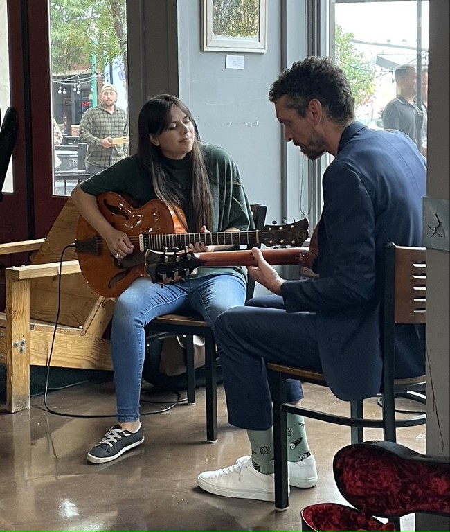 Professor playing a guitar