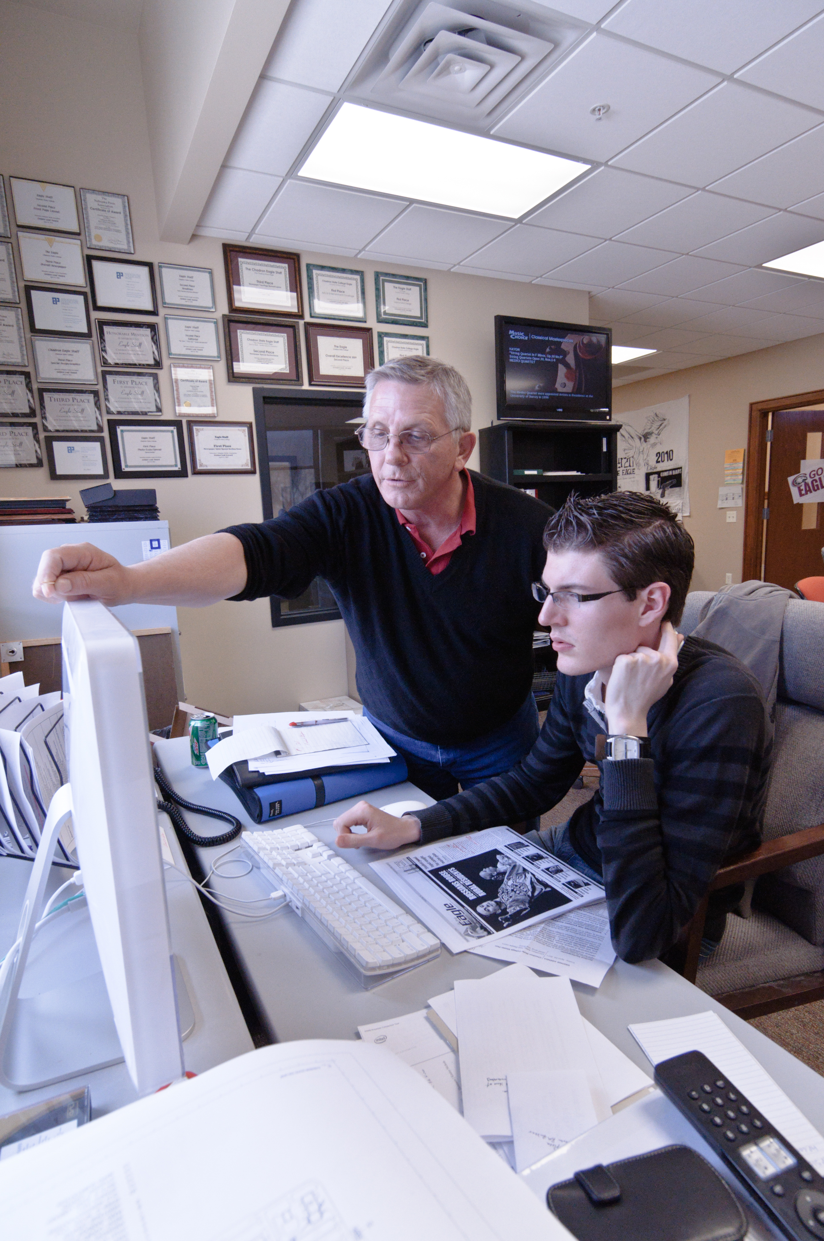 Faculty and student working at a computer