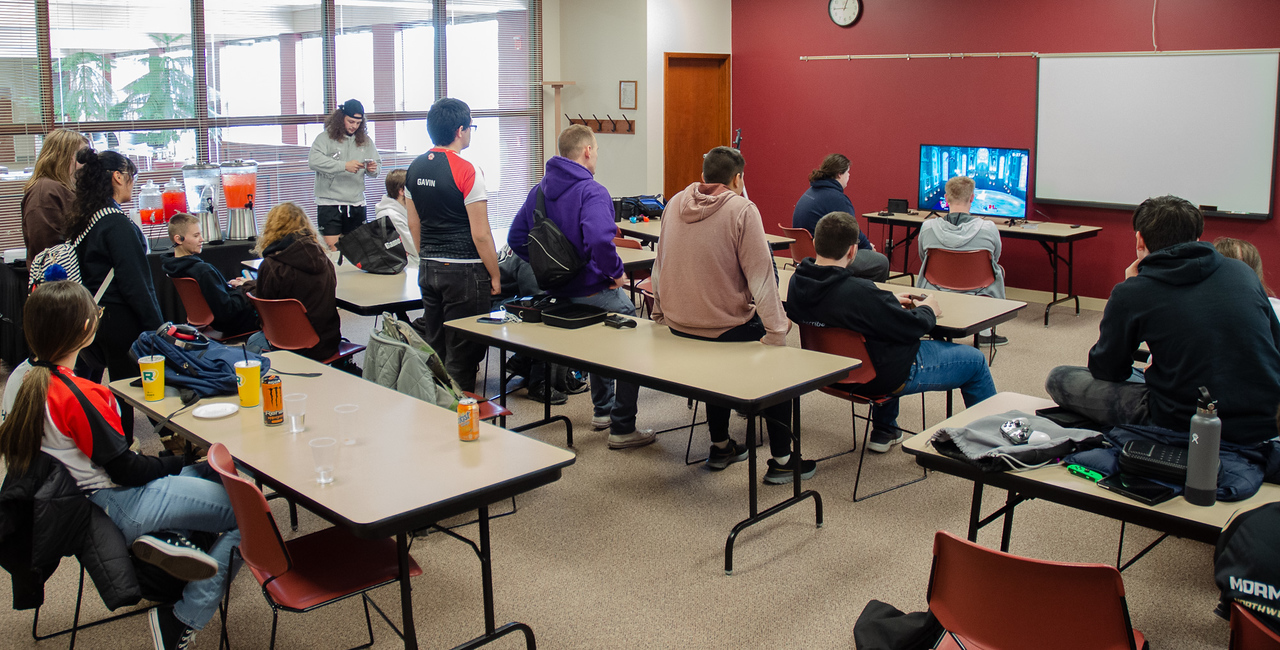 Students in a room looking at a screen