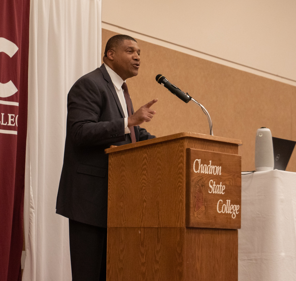 Man speaking at a podium