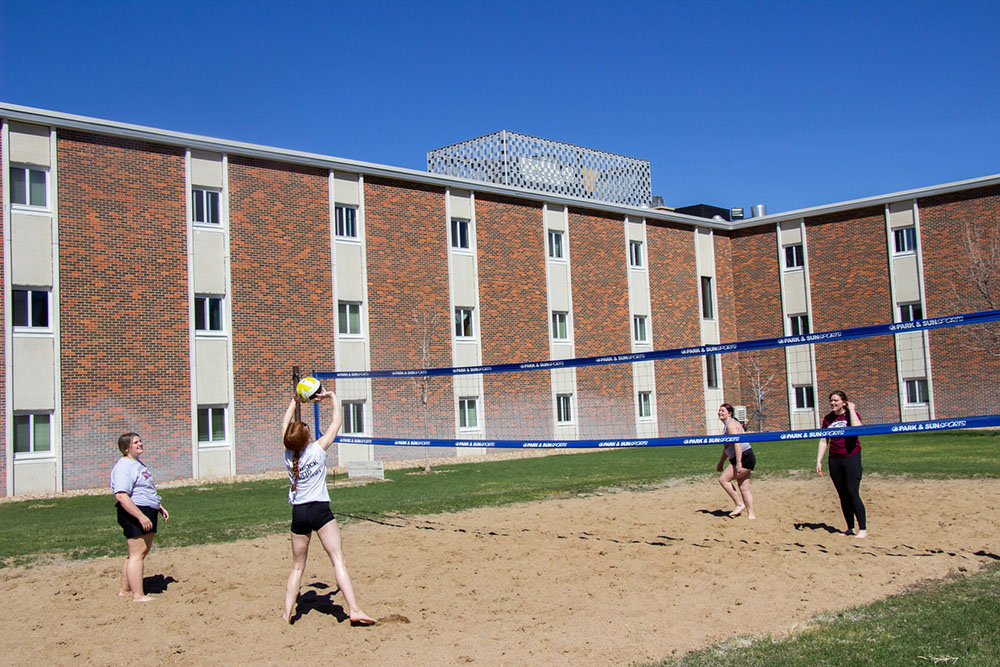 Students playing outdoor volleybal