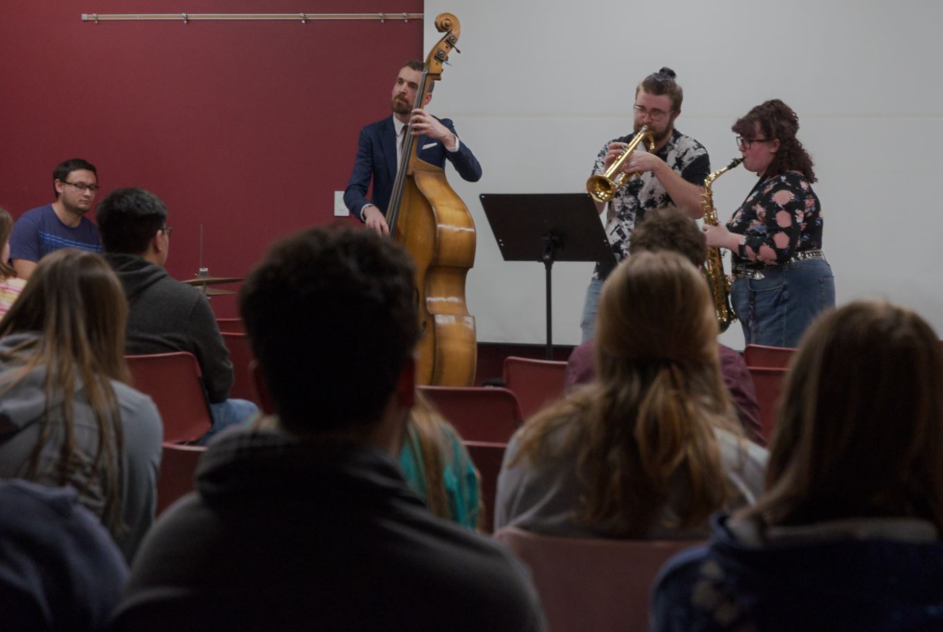 Faculty and students performing music