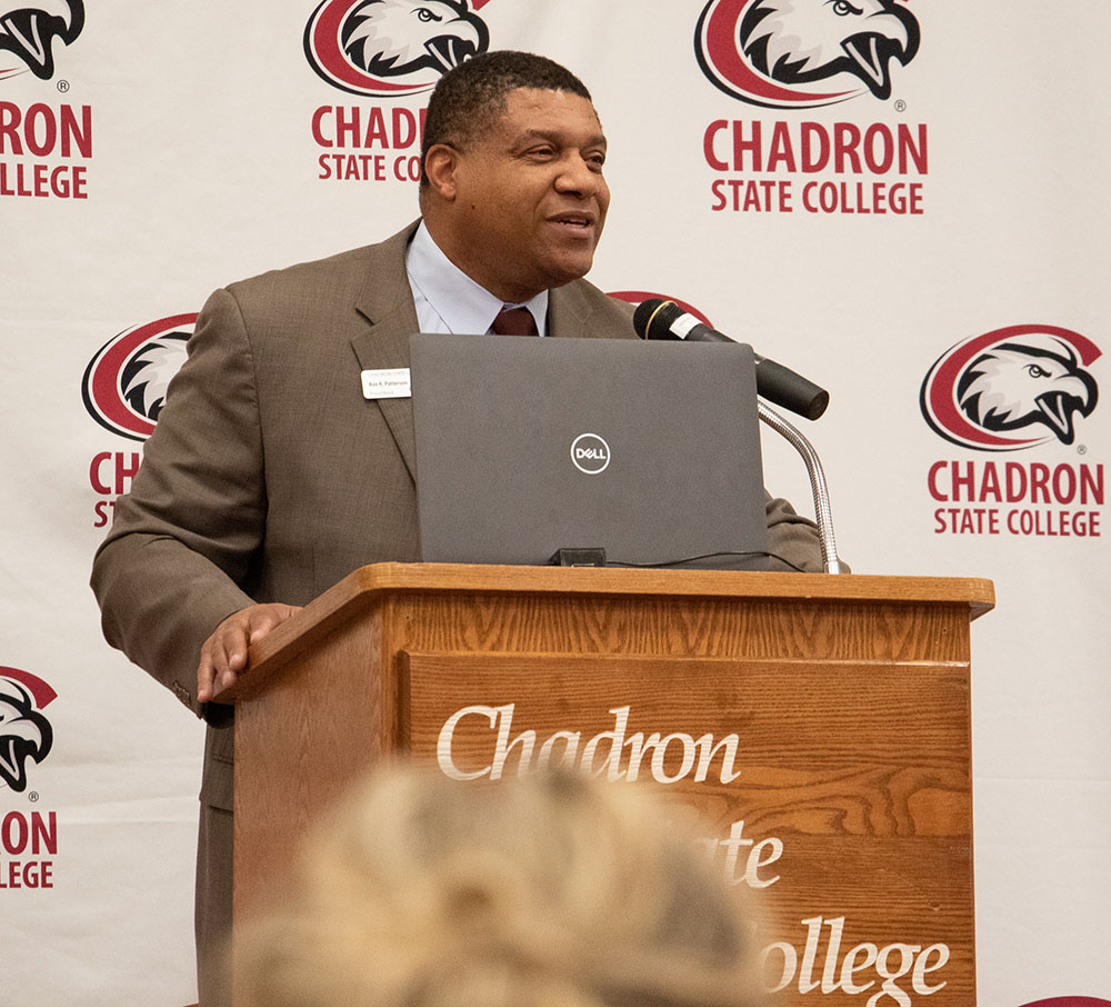 Adult male speaking at a podium