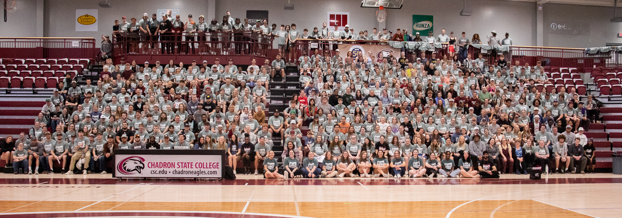 Large group seated in bleachers