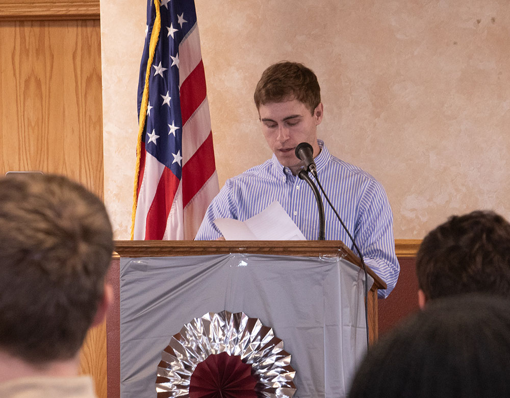 Adult male speaking at a podium