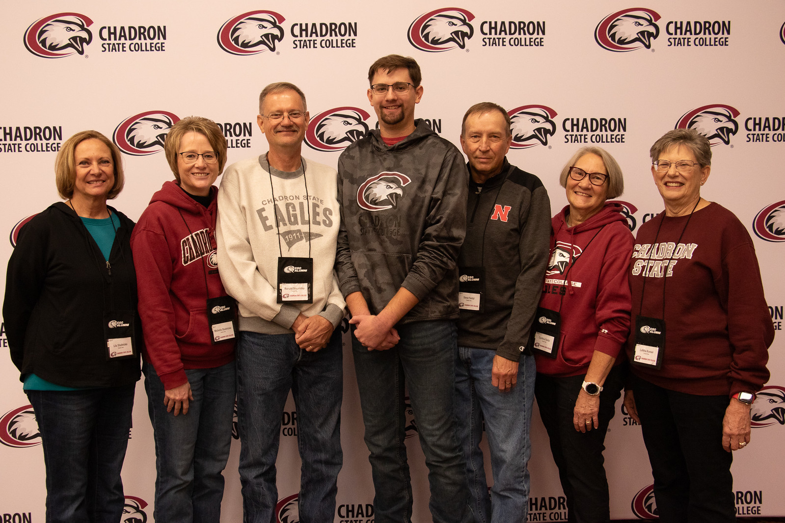 A group of adults posing indoors