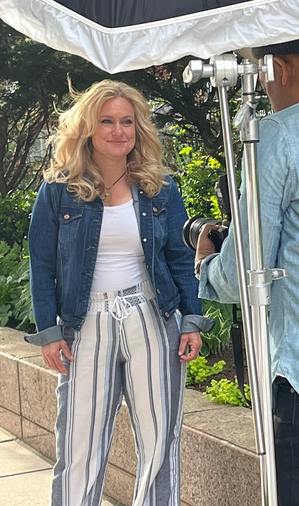 Woman posing in front of a camera