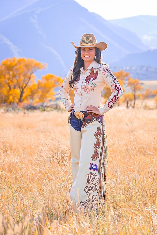 Rodeo queen standing in a field