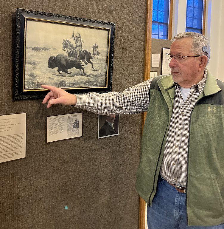 Man with art in a display