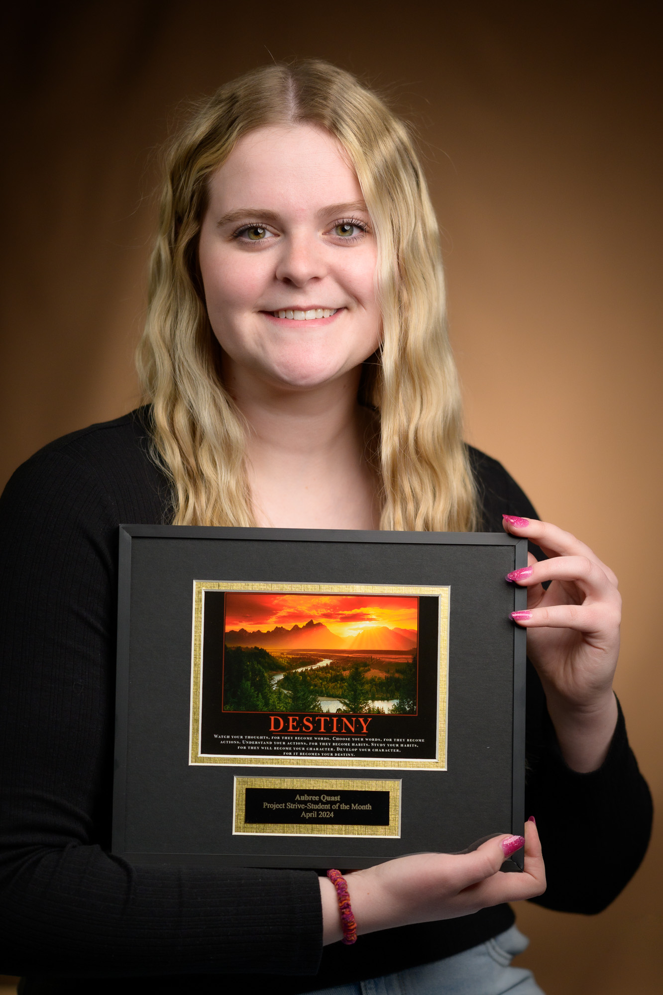 Woman holding a plaque