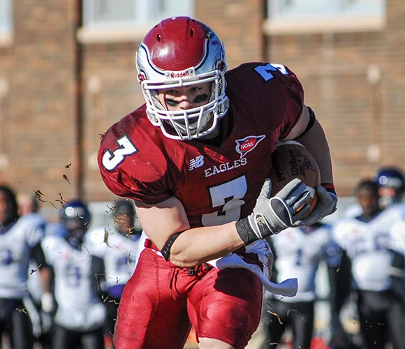 Football player running toward camera