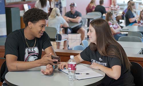 Two students chat in the Student Center