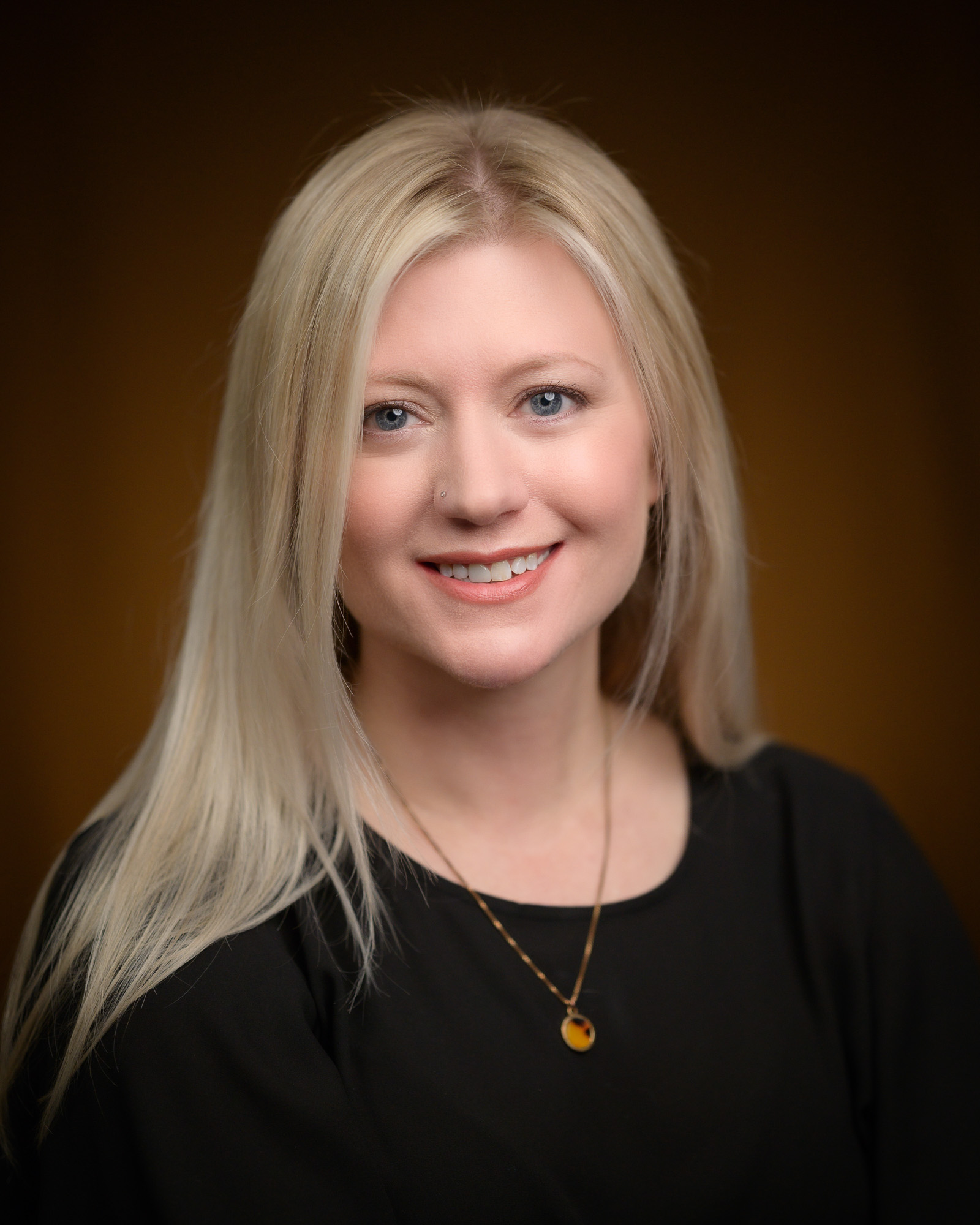 A headshot of a women