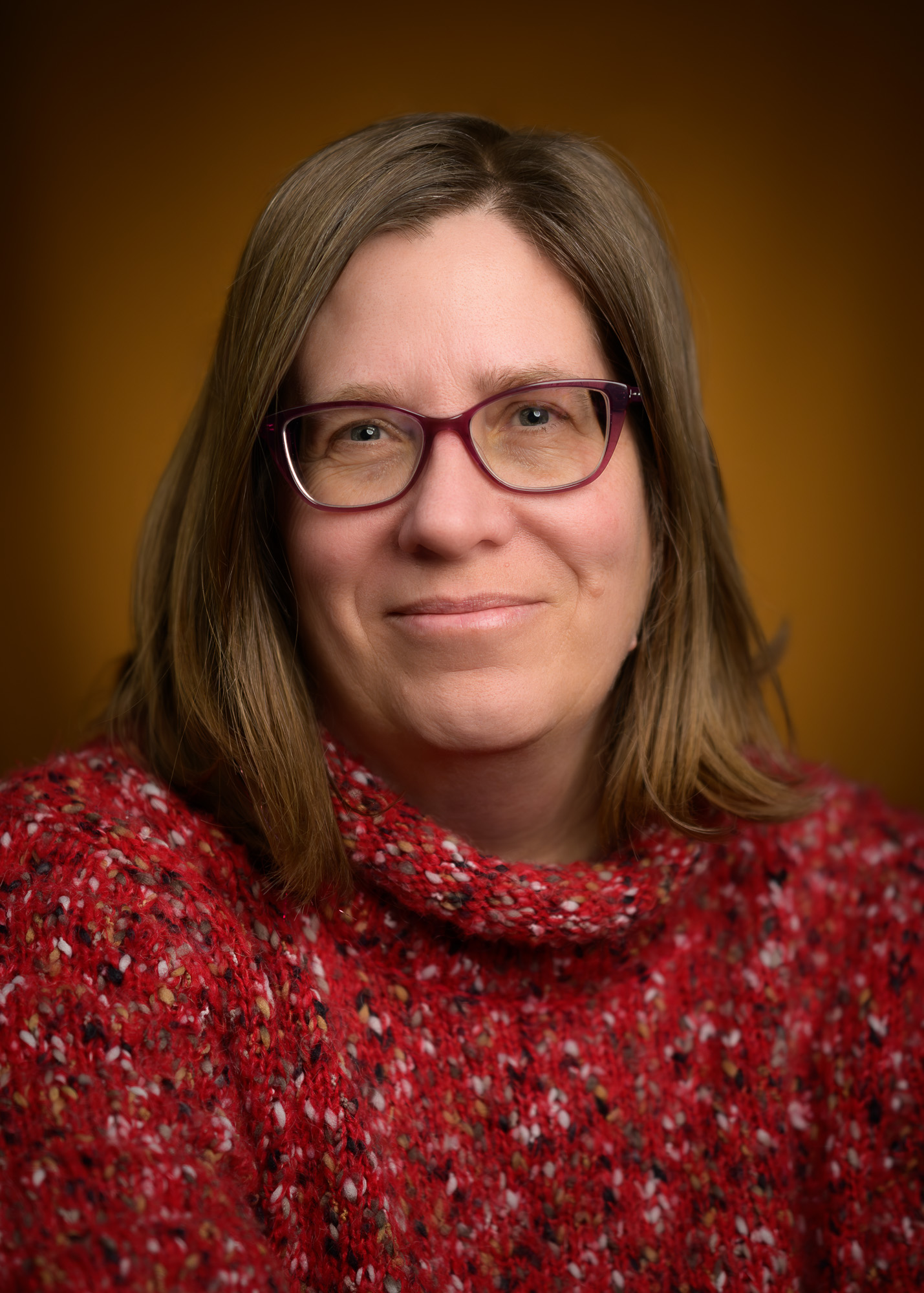 A headshot of a women