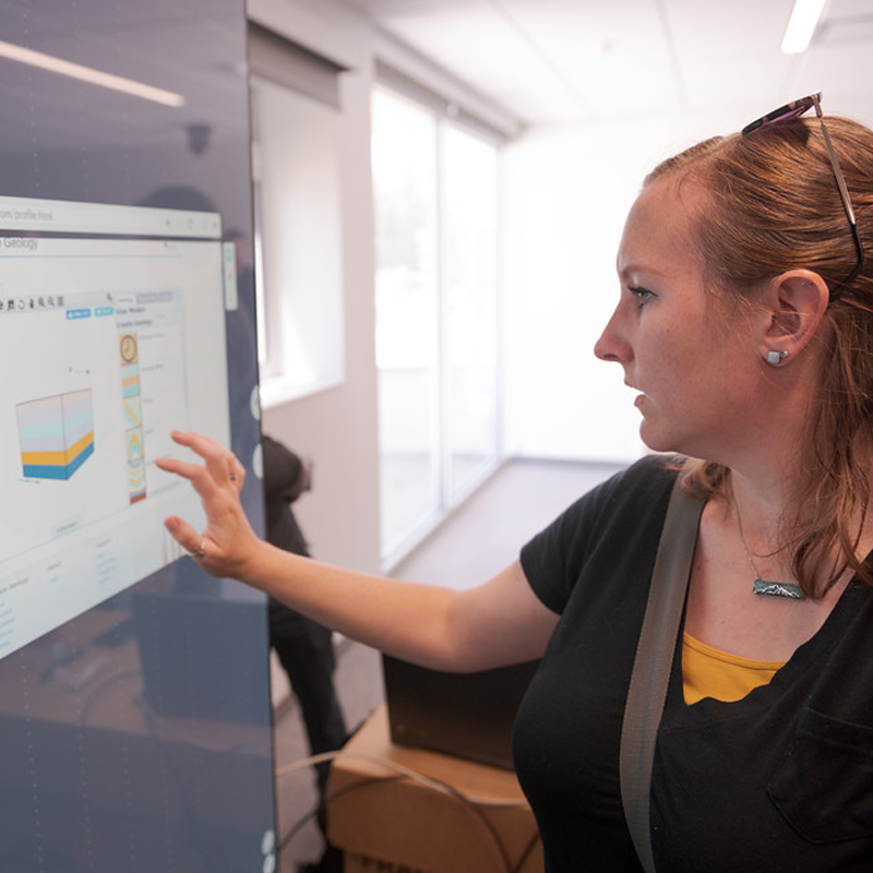 Dr. Tawny Tibbits, assistant professor, works with an interactive display during a training demonstration in the Math Science Center of Innovative Learning on May 26, 2022. The multi-user display can be used in a variety of ways for math and science faculty and students. (Photo by Daniel Binkard/Chadron State College)